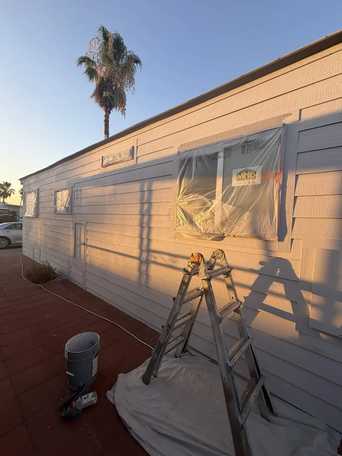 Orange Coatings — painter at work